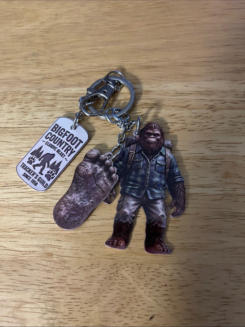Bigfoot Country Keychain - Forest Green Bigfoot Figure and Footprint
